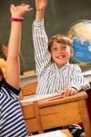 Boy with hand raised