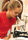 Intermediate student with microscope