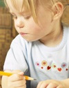 Two young girls writing