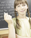 Girl writing on chalkboard
