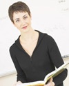 Female science teacher holding book