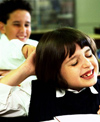 Boy pulling girl's hair