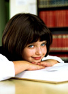 Young girl smiling in library