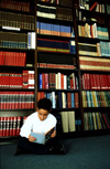 Boy in library reading