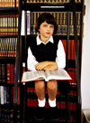 Student in library with book