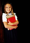 Young girl holding books