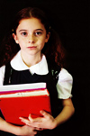 Girl with book in library
