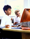 Boys reading on computer