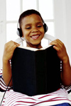 Young boy reading book