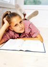 Young girl reading book
