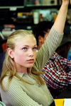 Girl raising her hand in class