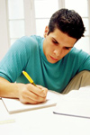 Male student writing