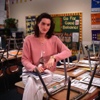 Teacher sitting in empty classroom
