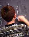 Boy completing math problem
