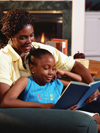 Mother and daughter reading in chair