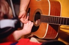 Child playing guitar