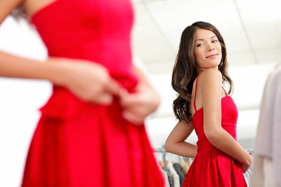 Teen Girl Trying on Red Prom Dress