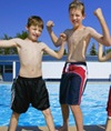 Boys posing by pool