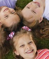 Girls laying in grass