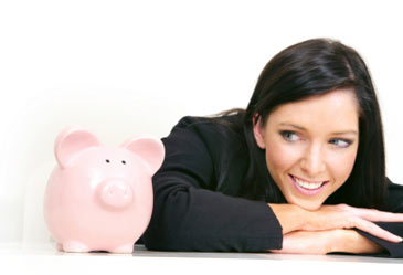 woman looking patiently looking at piggy bank