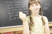 Girl in front of blackboard