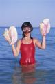 Girl holding seashells