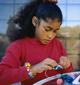 Hispanic child working on art project
