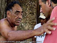 The shaman removes bad spirits from Dan and casts them away by appealing to different saints.