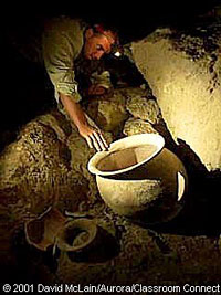 Dan Buettner finds an almost perfectly preserved Maya pot in the cave.