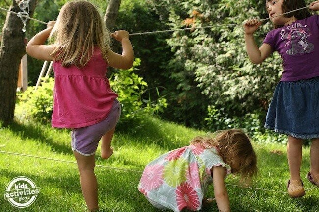 Playing on Homemade Tight Rope in Backyard
