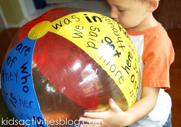 Young Kid Holding Beach Ball