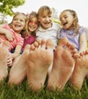 Girls bare foot in grass