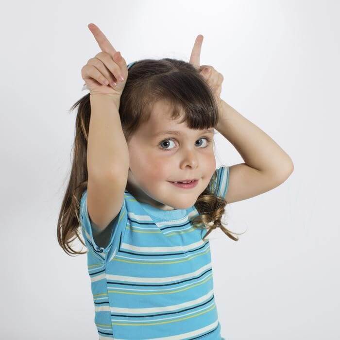 Little Girl Playing Animal Charades