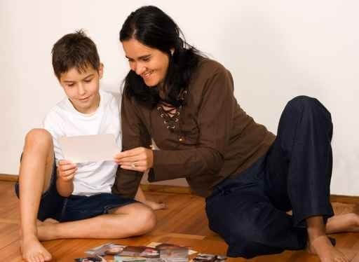 Mother and Son Looking at Family Photos