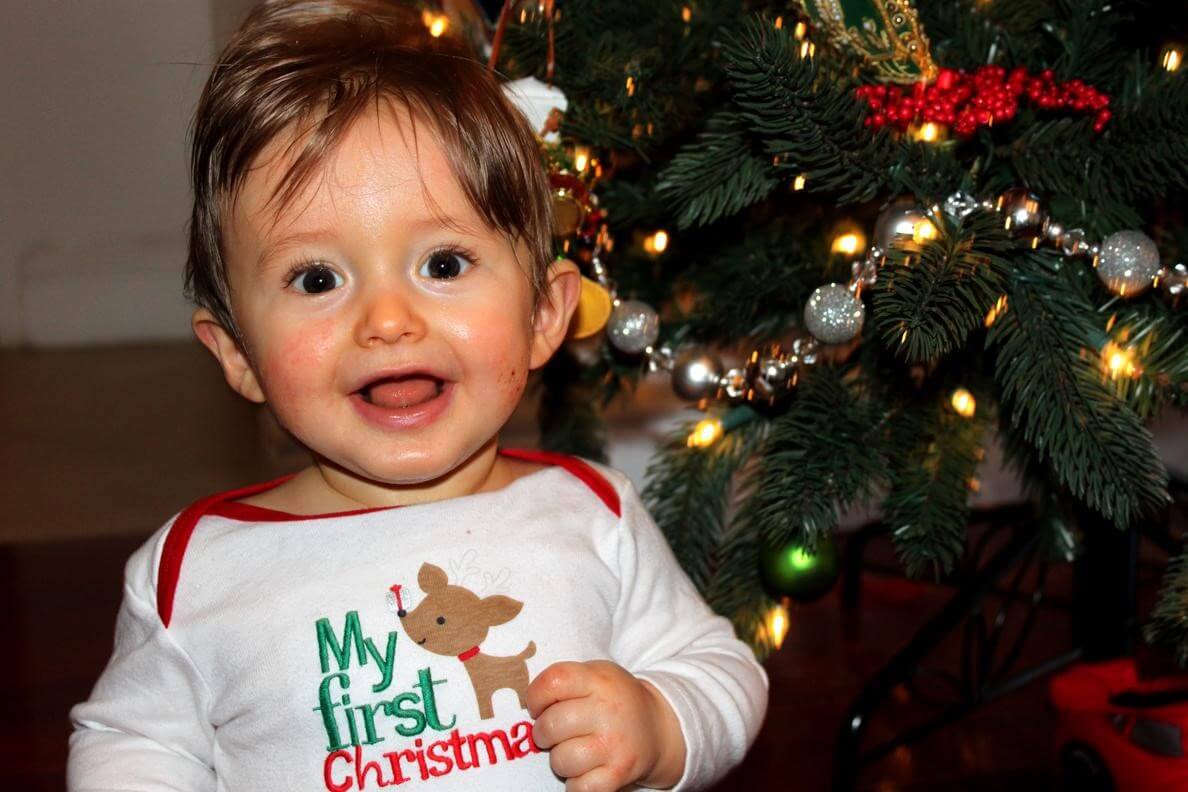 Baby in Front of Christmas Tree