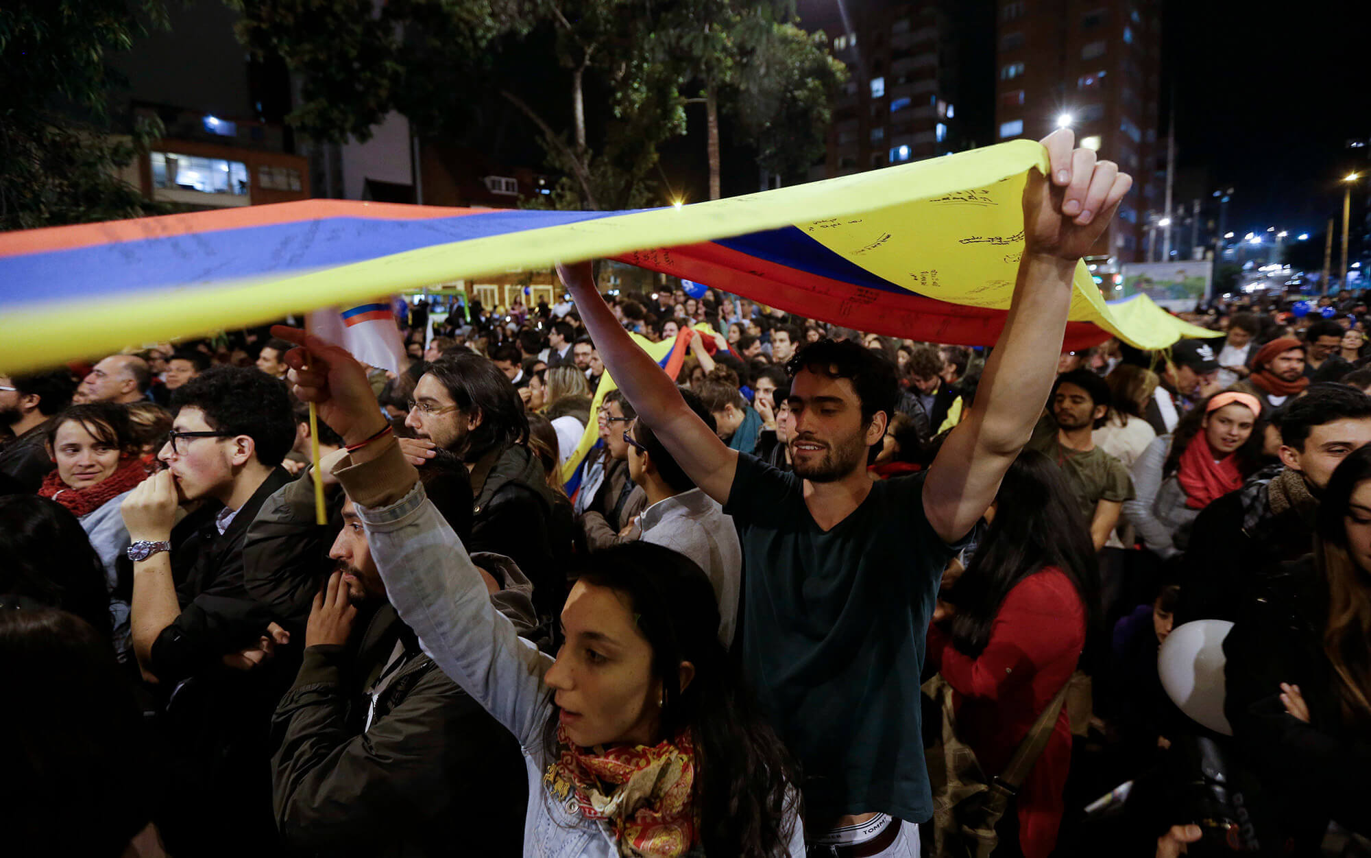 People celebrate the announcement of peace in Colombia