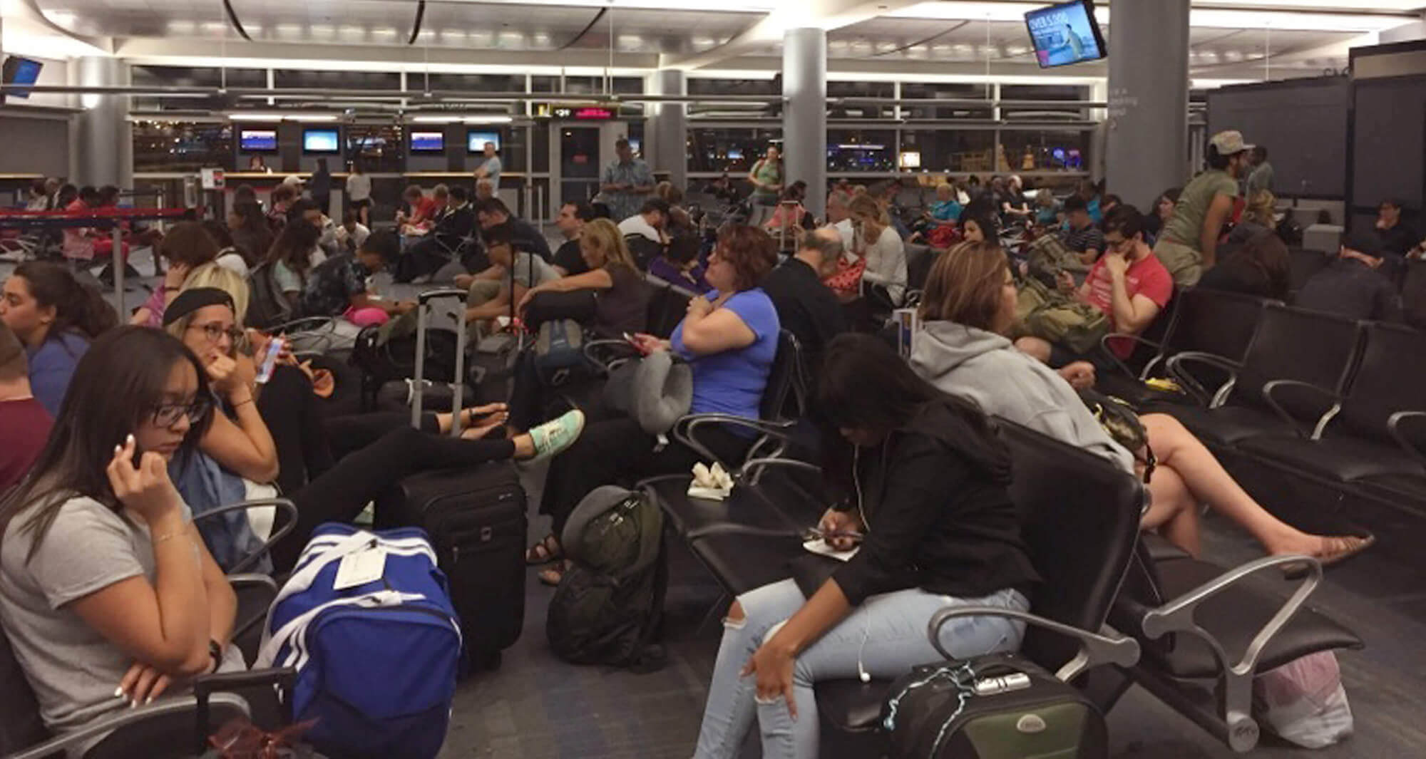 Image of passengers in the Delta Airlines boarding area at McCarran International Airport