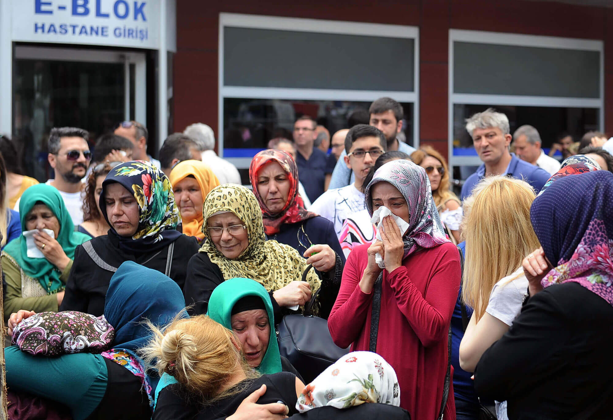 Image of women crying outside the Istanbul Airport
