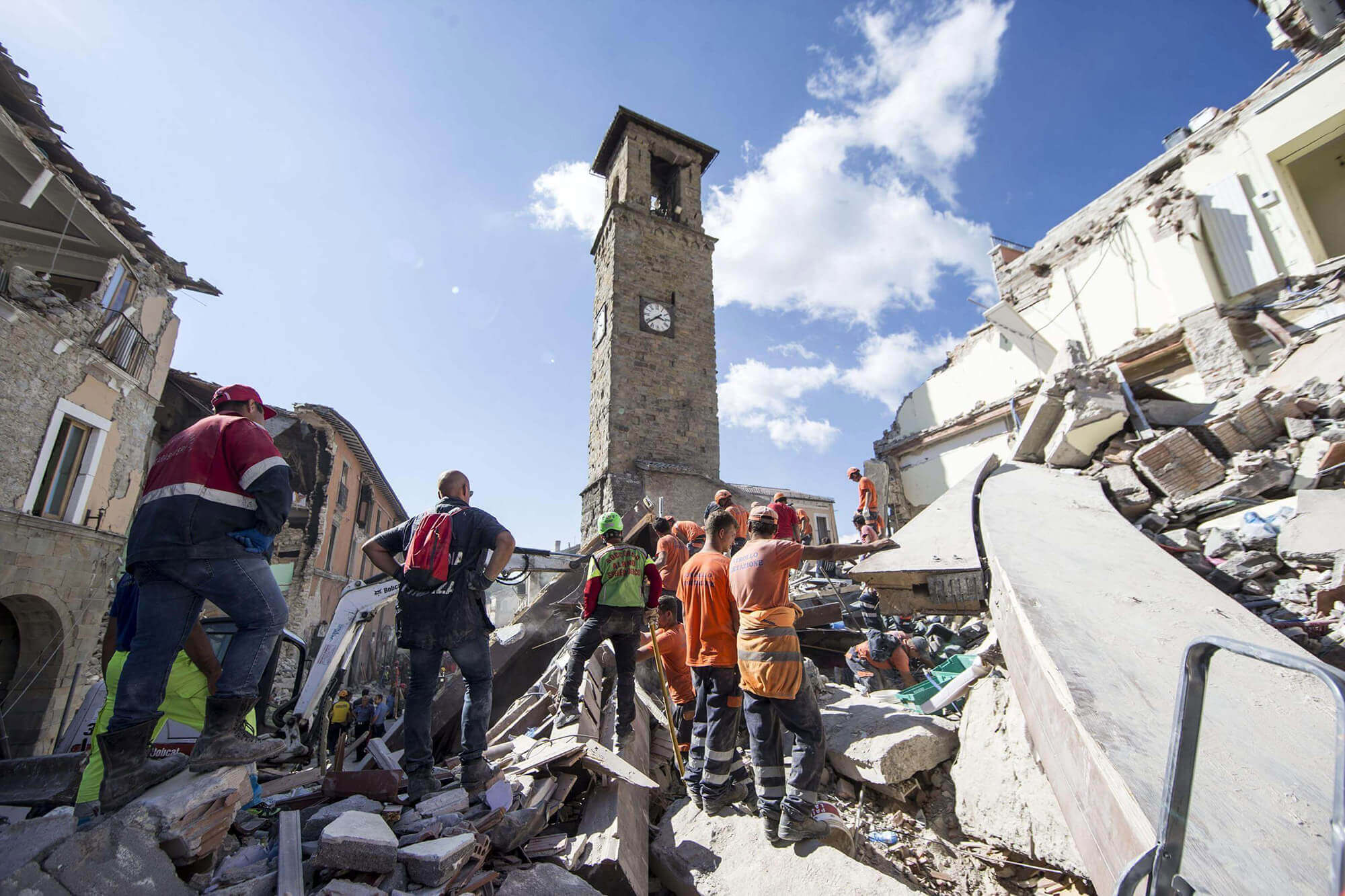 Rescuers search through debris following an earthquake in Amatrice, central Italy