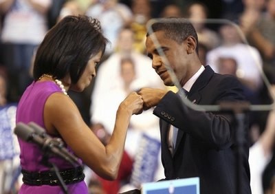 Newly nominated Obama fist bumps wife Michelle